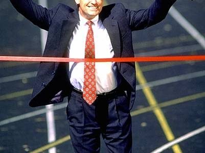 Salesman crossing finishline